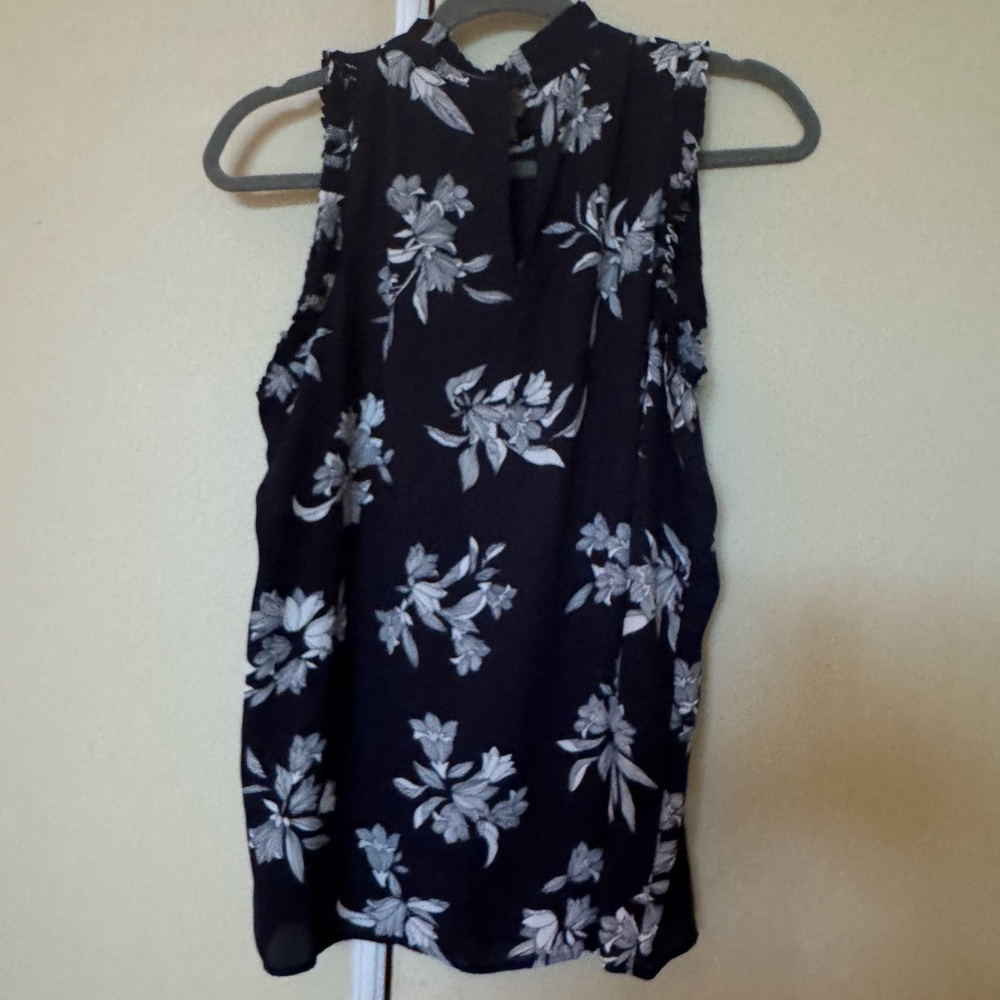 Floral Sleeveless Navy blue and White Top with 1 button & loop closure at back.